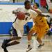 Pioneer senior Forrest Neal is defended by Ypsilanti junior Janeau Joubert in the game on Monday, March 4. Daniel Brenner I AnnArbor.com